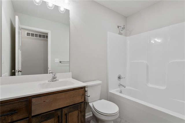 full bathroom featuring vanity, toilet, and  shower combination