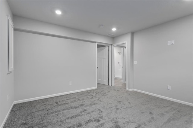 unfurnished bedroom with carpet flooring and a closet