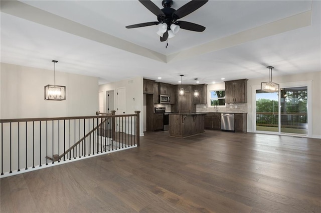 1316 N Holland Ct, Independence, MO 64056 - unfurnished living room featuring a chandelier, dark wood-type flooring, ceiling fan, recessed lighting, and a sink