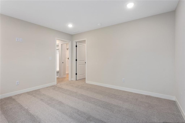 1316 N Holland Ct, Independence, MO 64056 - unfurnished room with light colored carpet, recessed lighting, and baseboards