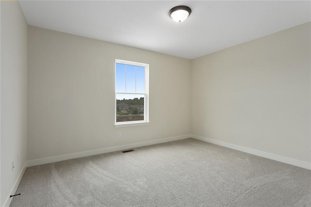 1316 N Holland Ct, Independence, MO 64056 - carpeted spare room featuring baseboards