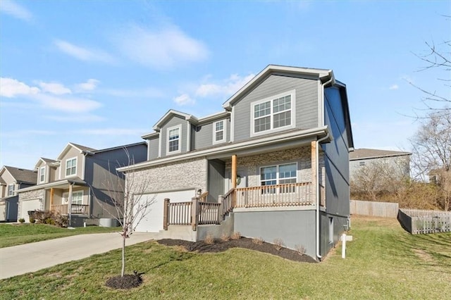 view of front of property featuring a porch, a garage, and a front lawn