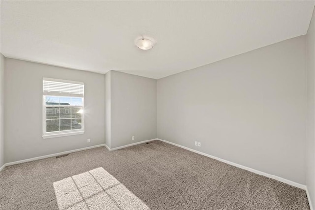 spare room featuring carpet flooring