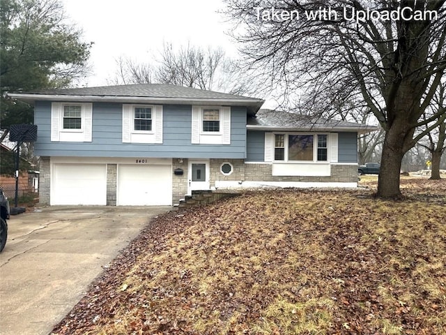 split level home featuring a garage