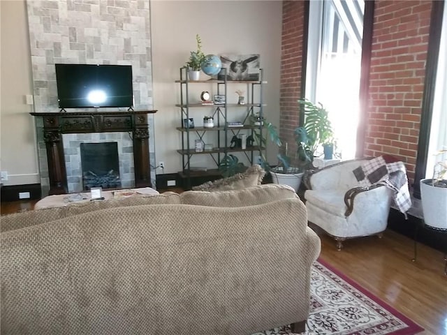 living room featuring hardwood / wood-style flooring and a fireplace