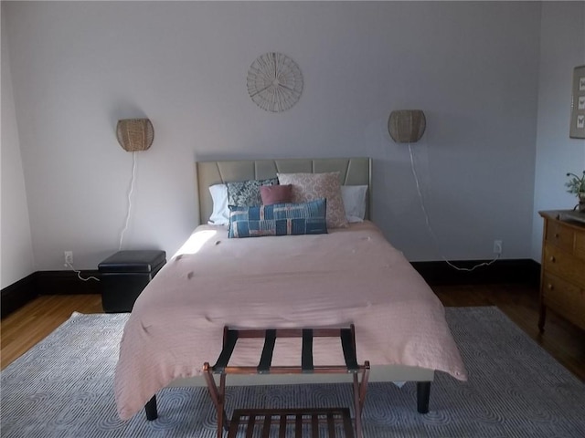 bedroom with dark wood-type flooring