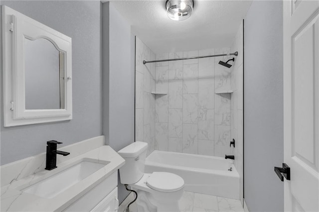 full bathroom featuring vanity, toilet, a textured ceiling, and tiled shower / bath