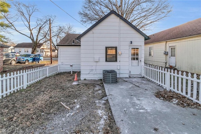 back of property with central air condition unit