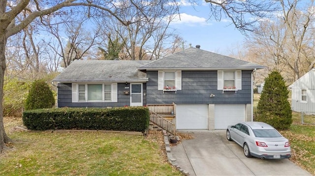 view of front of home with a garage and a front yard