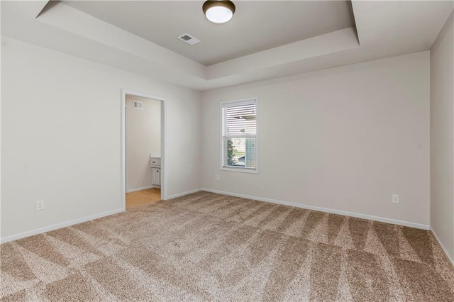 9509 W 164th St, Stilwell, KS 66085 - unfurnished room with a tray ceiling and light colored carpet