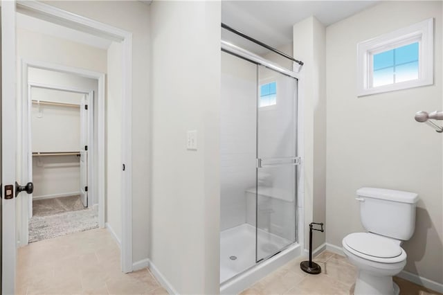 9509 W 164th St, Stilwell, KS 66085 - full bath with a stall shower, tile patterned floors, and a spacious closet