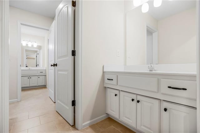 bathroom featuring tile patterned flooring and vanity