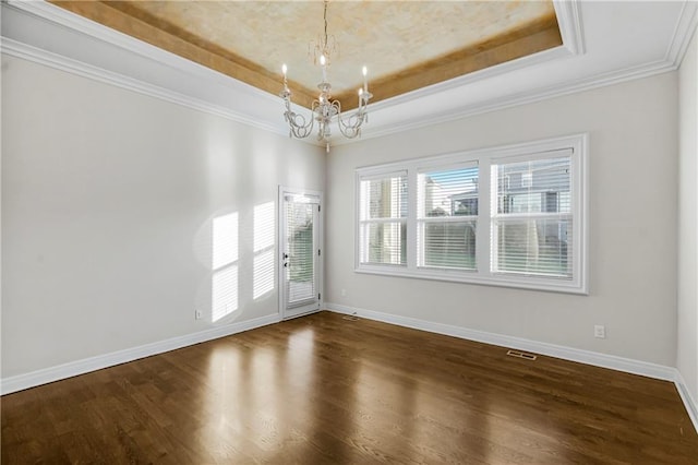 9509 W 164th St, Stilwell, KS 66085 - unfurnished room featuring a raised ceiling, a chandelier, dark wood-type flooring, and crown molding