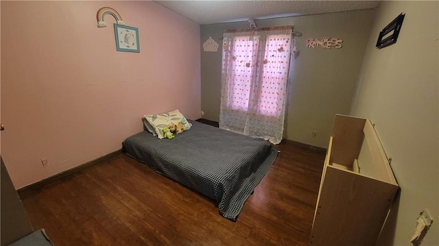 423 Elm St, Mound City, KS 66056 - bedroom with dark hardwood / wood-style flooring