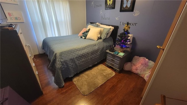 423 Elm St, Mound City, KS 66056 - bedroom with dark hardwood / wood-style floors