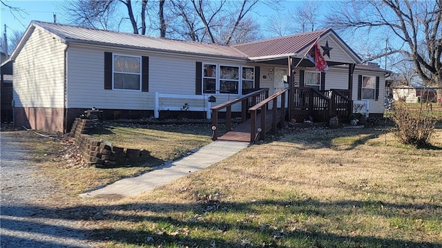 423 Elm St, Mound City, KS 66056 - view of front of home with a porch and a front lawn