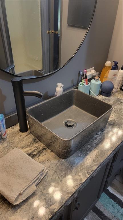 423 Elm St, Mound City, KS 66056 - bathroom featuring vanity