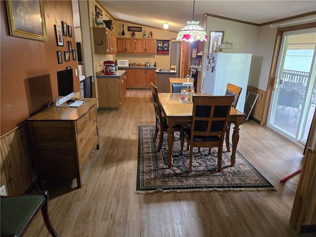 423 Elm St, Mound City, KS 66056 - dining space featuring light wood finished floors and crown molding