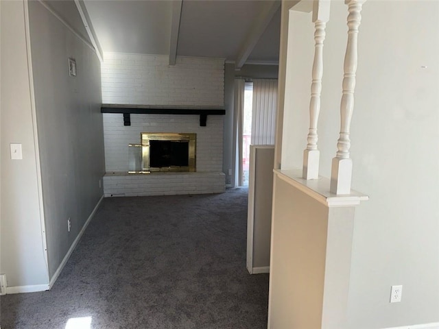 hallway featuring dark carpet and beam ceiling