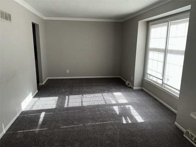 empty room featuring ornamental molding and dark carpet