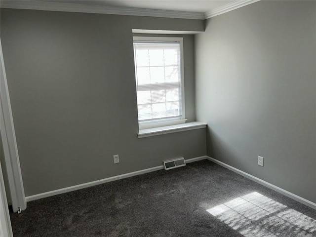 spare room with crown molding and dark carpet