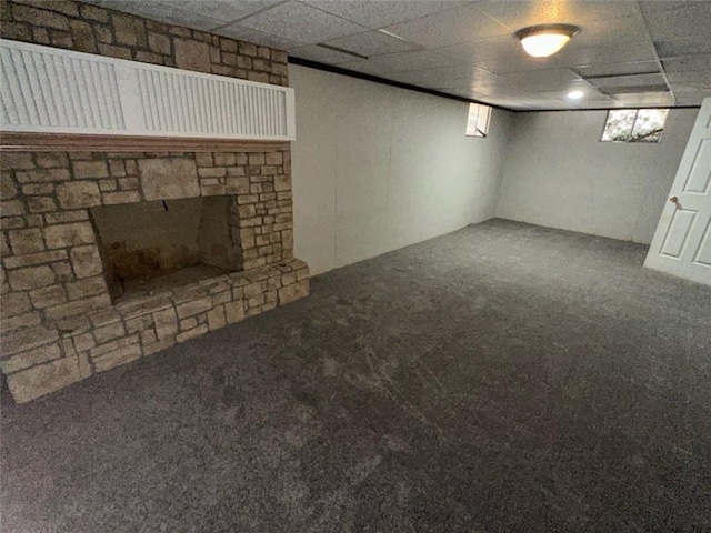 basement with a fireplace and carpet floors