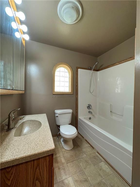 full bathroom with vanity, toilet, and bathtub / shower combination