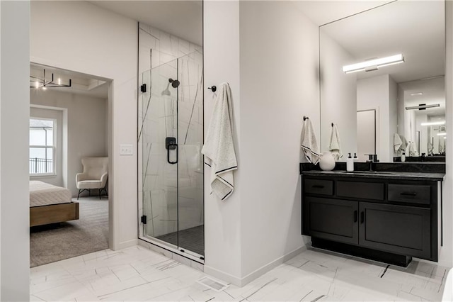 bathroom with vanity and a shower with shower door