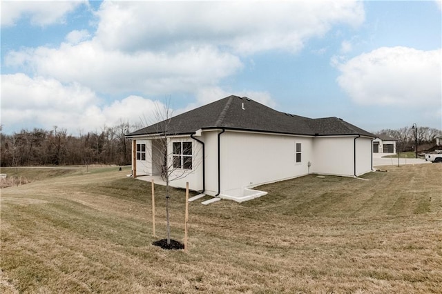 view of home's exterior featuring a lawn