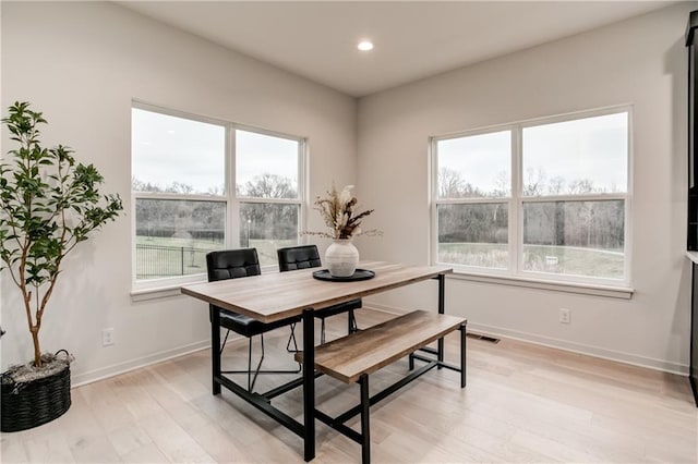 office with light hardwood / wood-style floors