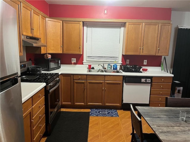 kitchen with sink and appliances with stainless steel finishes