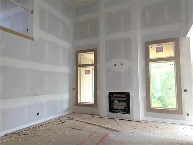 14709 Fairway St, Leawood, KS 66224 - unfurnished living room with a fireplace and baseboards