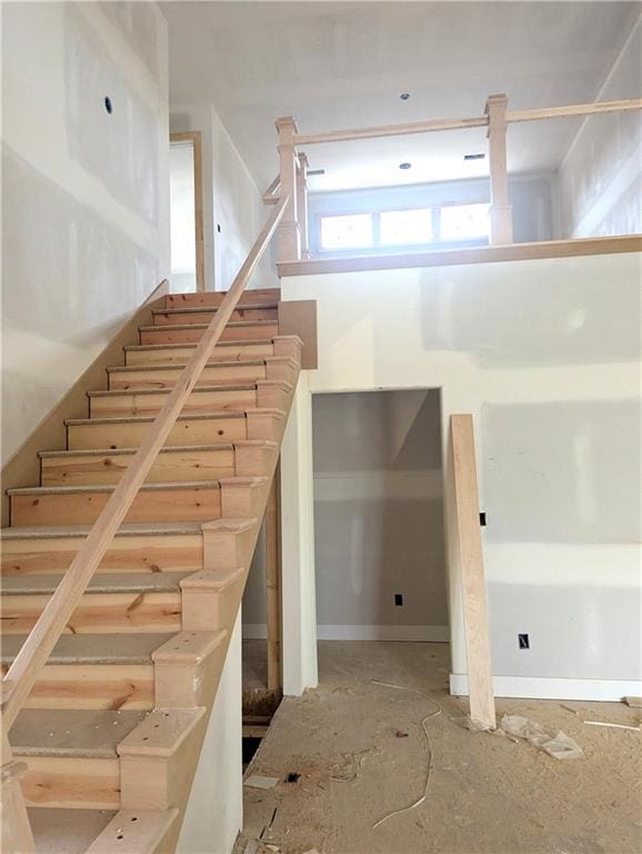 14709 Fairway St, Leawood, KS 66224 - stairs featuring baseboards