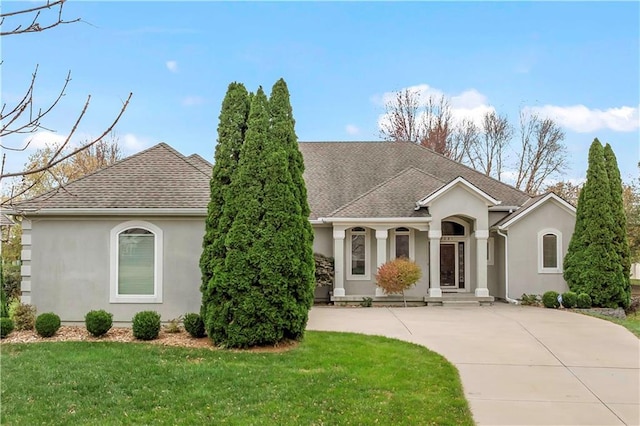 ranch-style home featuring a front yard