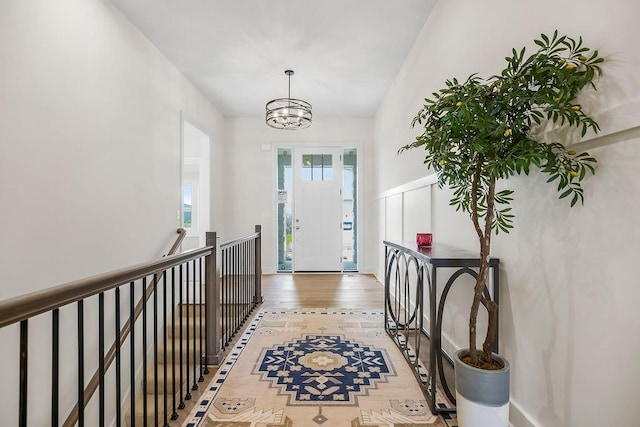 4102 W 158th Ter, Overland Park, KS 66224 - foyer entrance with a chandelier and light wood-style floors
