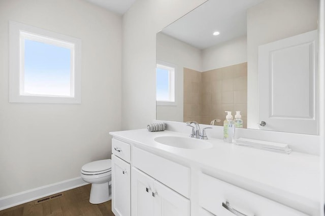 4102 W 158th Ter, Overland Park, KS 66224 - bathroom featuring vanity, toilet, baseboards, and wood finished floors