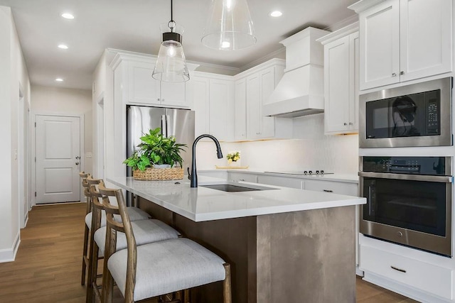 4102 W 158th Ter, Overland Park, KS 66224 - kitchen featuring stainless steel appliances, a sink, custom range hood, recessed lighting, and light countertops