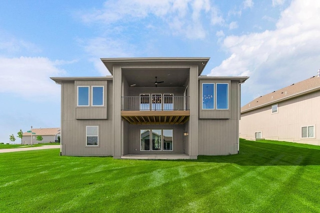 4102 W 158th Ter, Overland Park, KS 66224 - rear view of house with ceiling fan, a balcony, a patio, and a lawn