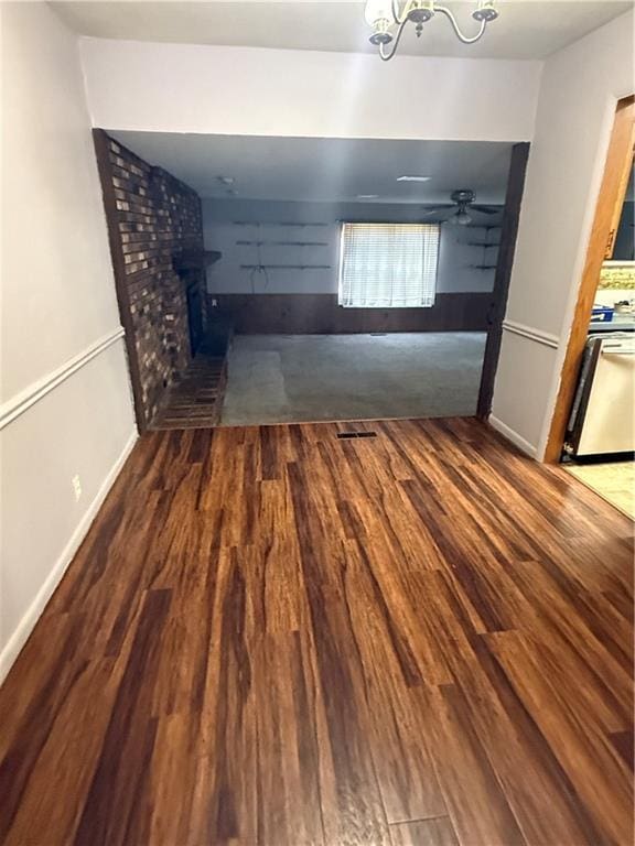 interior space featuring dark hardwood / wood-style flooring and a notable chandelier