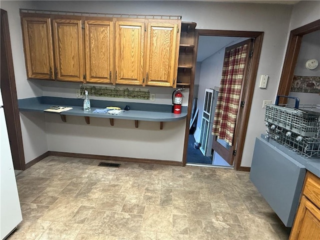 kitchen featuring refrigerator