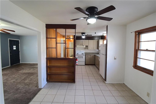 kitchen featuring light colored carpet and white appliances