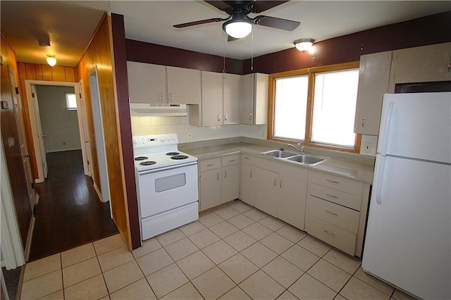 kitchen with white appliances, white cabinets, sink, ceiling fan, and tasteful backsplash