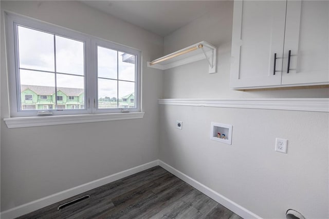 washroom with electric dryer hookup, hookup for a washing machine, and dark wood-type flooring