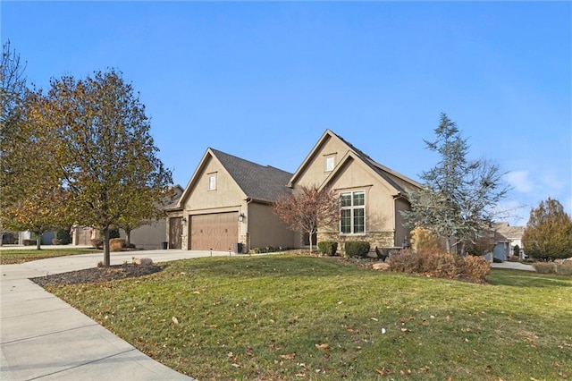 view of front facade with a garage and a front lawn