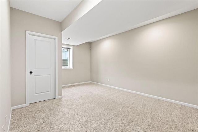 empty room with light colored carpet