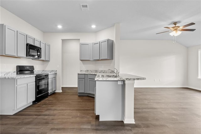 kitchen featuring gray cabinets, sink, black appliances, and dark wood-type flooring