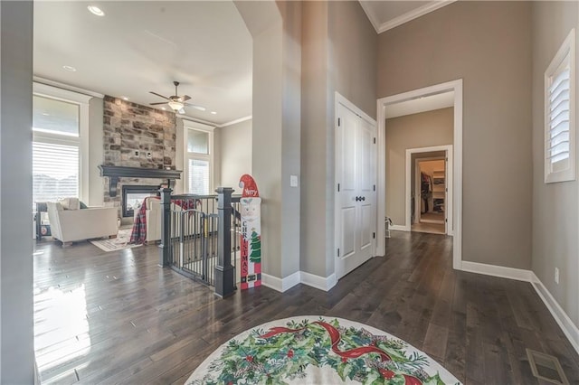 corridor featuring dark hardwood / wood-style floors and ornamental molding