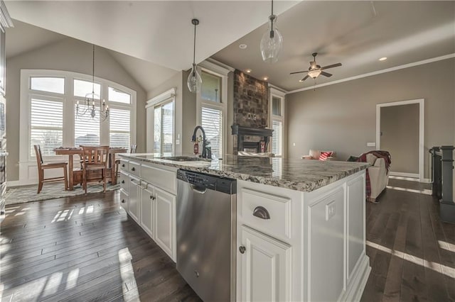 kitchen featuring a kitchen island with sink, white cabinets, stainless steel dishwasher, decorative light fixtures, and dark hardwood / wood-style flooring