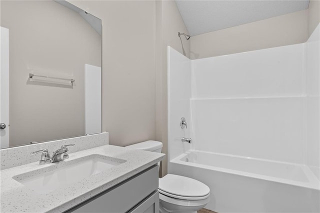 full bathroom featuring vanity, shower / bathtub combination, and toilet