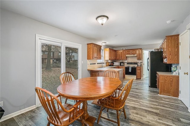 dining space featuring dark hardwood / wood-style flooring